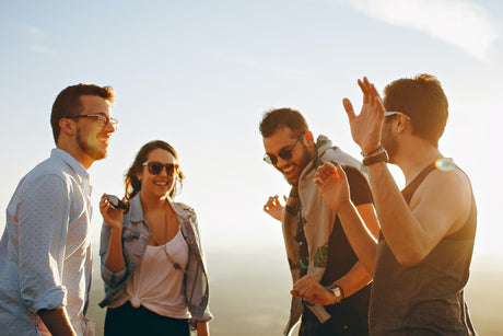 A group of friends smiling with eachother