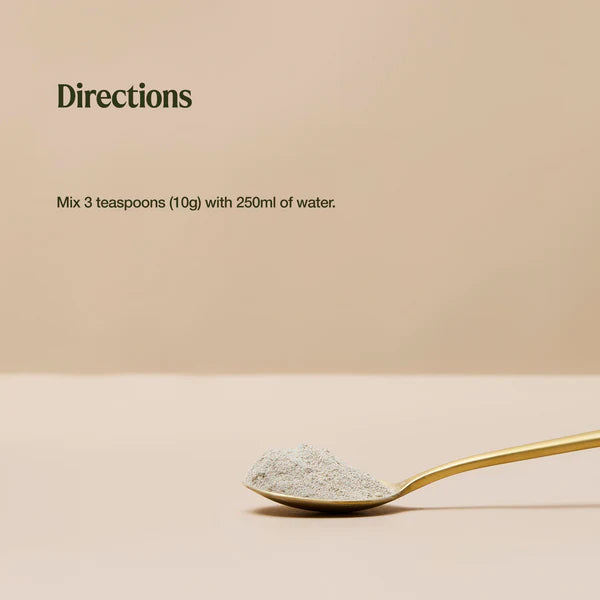 Spoon with multi vitamin powder and text on a beige background