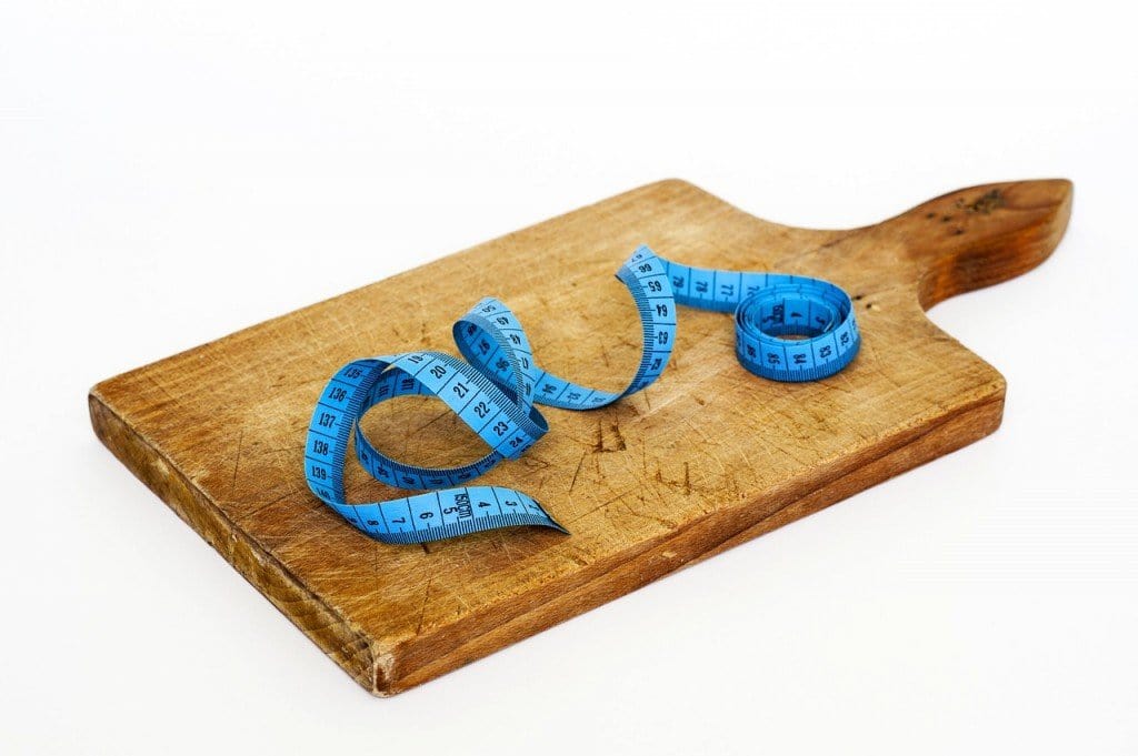 Measuring tape on cutting board