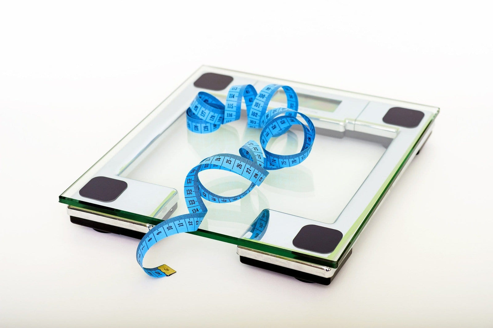 Blue measurement tape on a glass scale