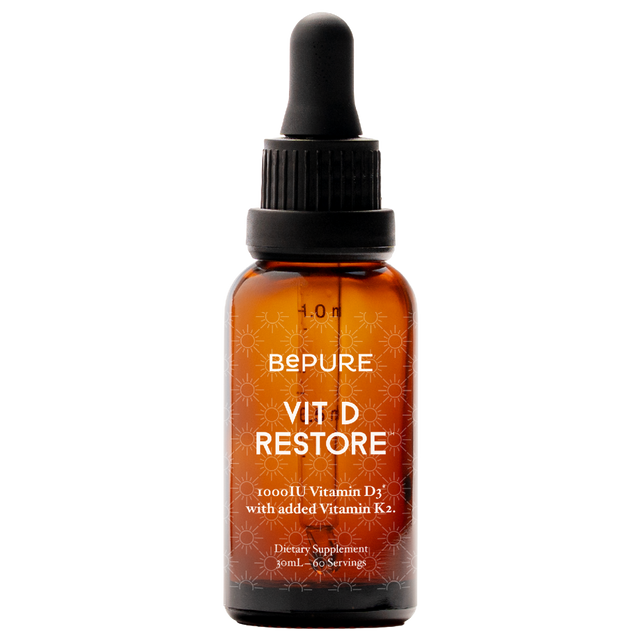 Vit D Restore supplement bottle with dropper on a white background