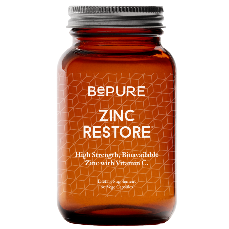 Orange supplement bottle labeled 'Bepure Zinc Restore' on a white background