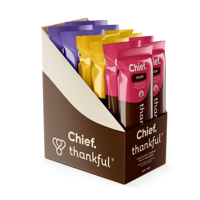 Box of Chief Thankful snack packs with colorful packaging on a white background