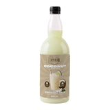 Bottle of coconut-flavored syrup with a white background