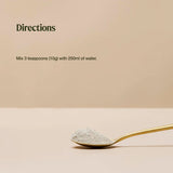 Spoon with multi vitamin powder and text on a beige background