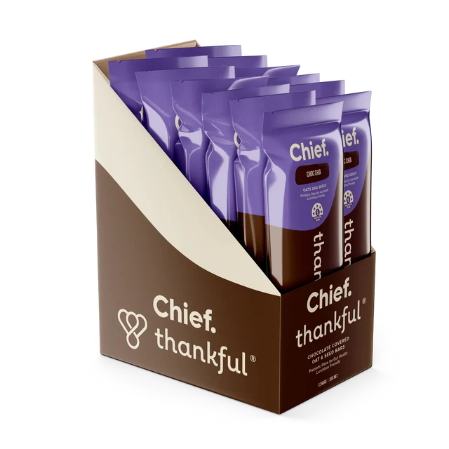 Packaging of Chief Thankful chocolate-covered oat and seed bars with purple packaging.
