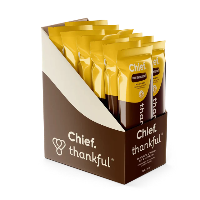 Packaging of Chief Thankful products with yellow bags and brown box on a white background