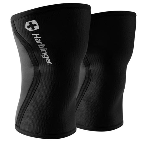 Pair of black knee sleeves with Harbinger logo on a white background