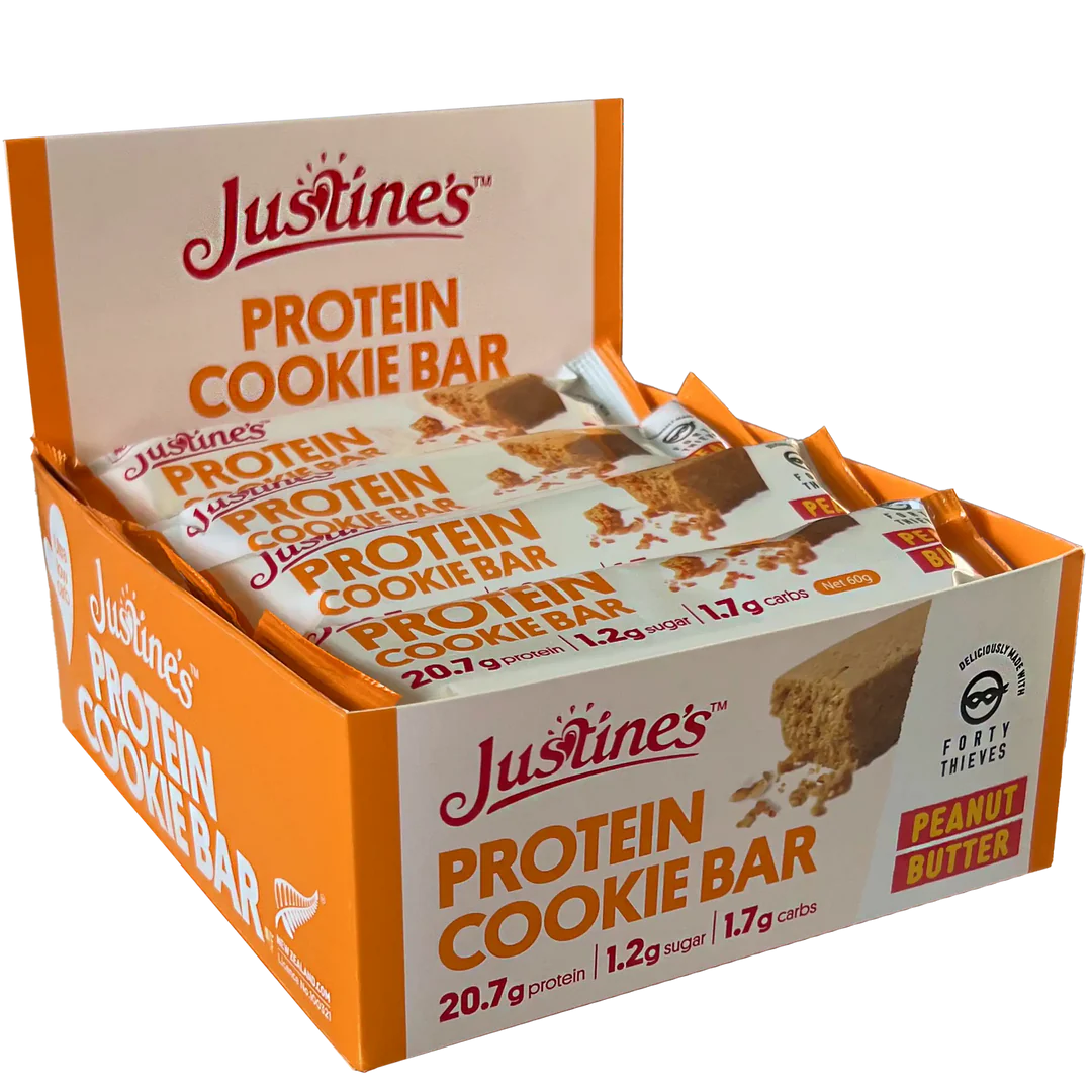 Box of Justine's Protein Cookie Bars with visible branding and product details.