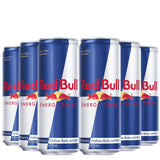Multiple cans of Red Bull energy drink arranged in a row on a white background